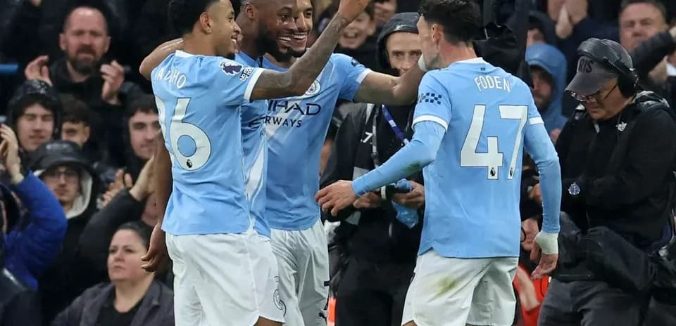 Manchester City players celebrating a goal