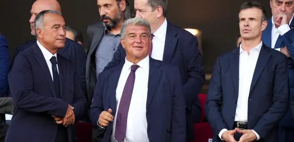 Group of executives in stadium box watching match