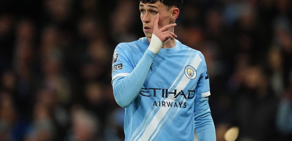 Player gesturing on the pitch during a match