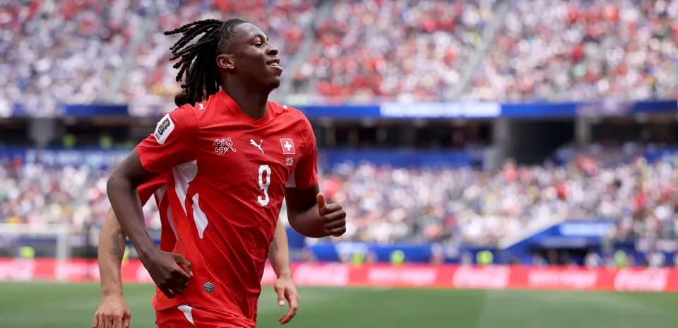 Player in red jersey running on the field