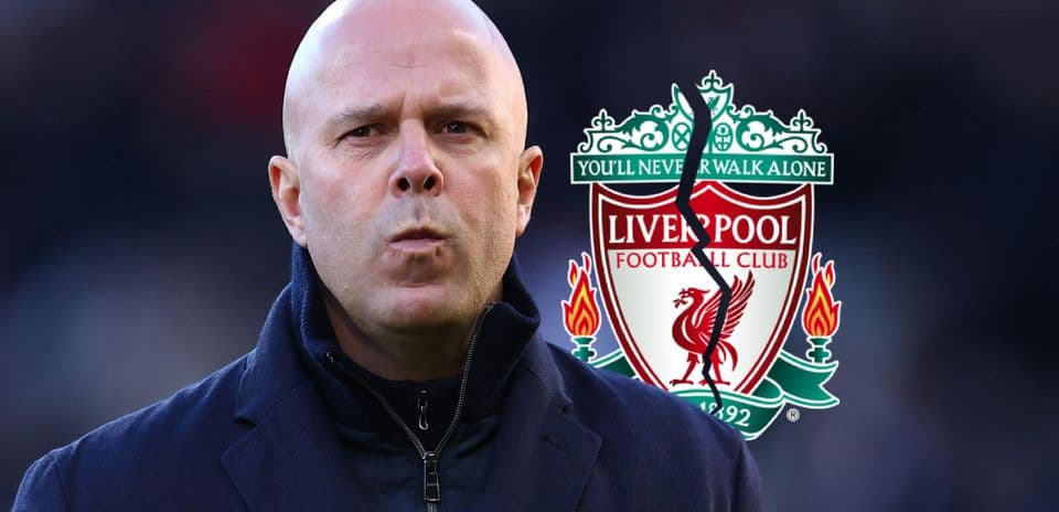 Coach in front of Liverpool FC club logo