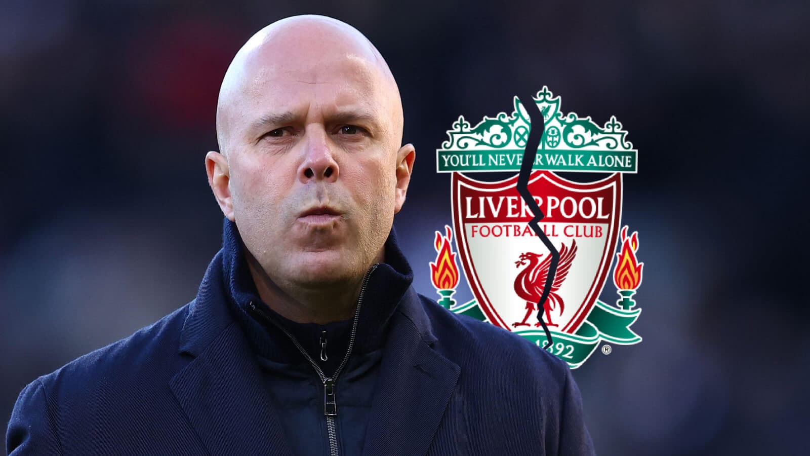 Coach in front of Liverpool FC club logo