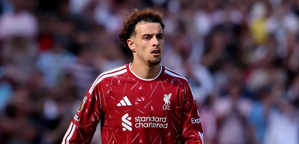 Player wearing Liverpool kit during match