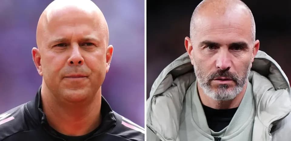Two football managers posing for the camera