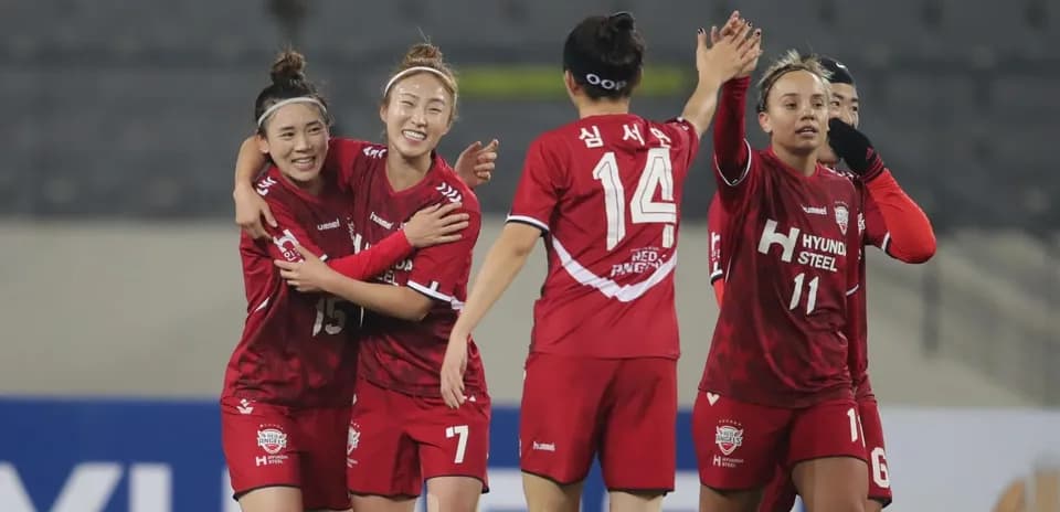 Players celebrating a goal in WK-League match