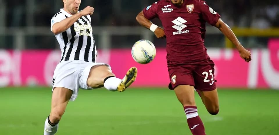 Player kicking ball during Torino vs Juventus match