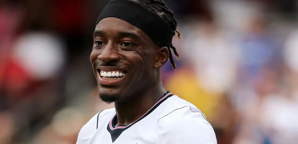 Player smiling during a soccer match