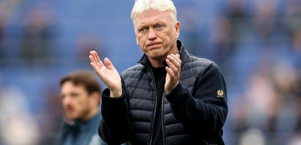 Manager clapping during match on the sidelines