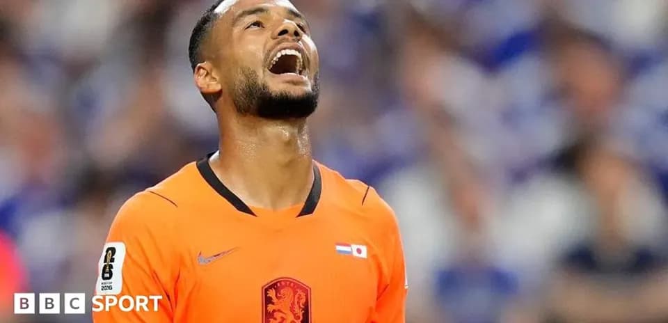 Player in orange jersey reacting during a match