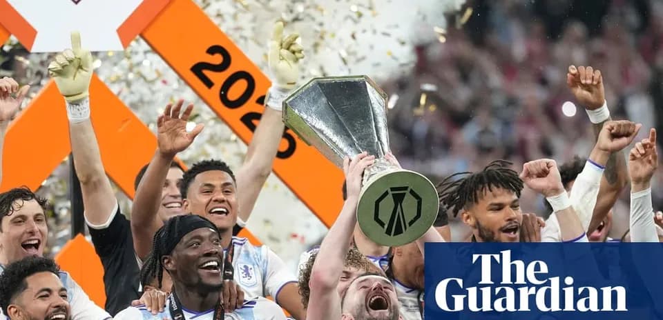 Players celebrating with trophy after championship victory