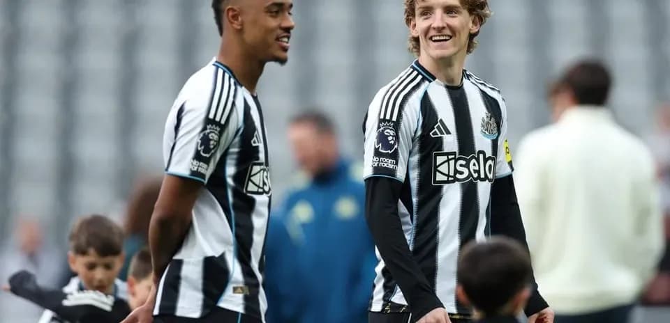 Newcastle players chatting on the pitch before match
