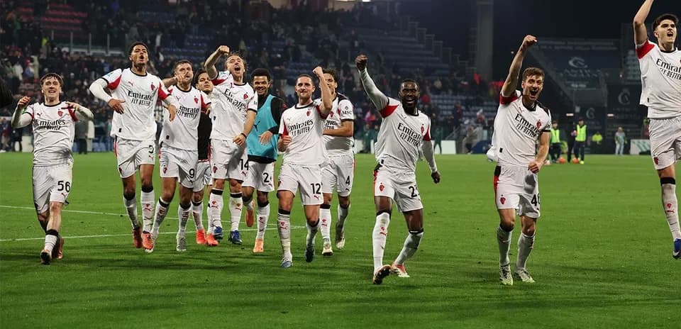 AC Milan players celebrating victory on the field