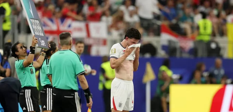 Player substituted during match, wiping face with towel