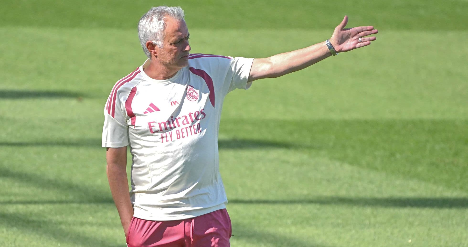 Coach directing players during training session
