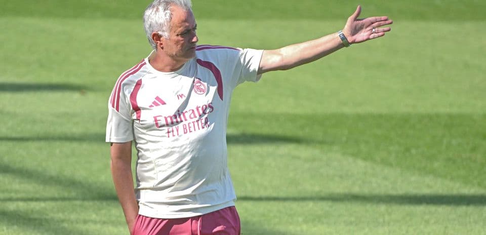 Coach directing players during training session