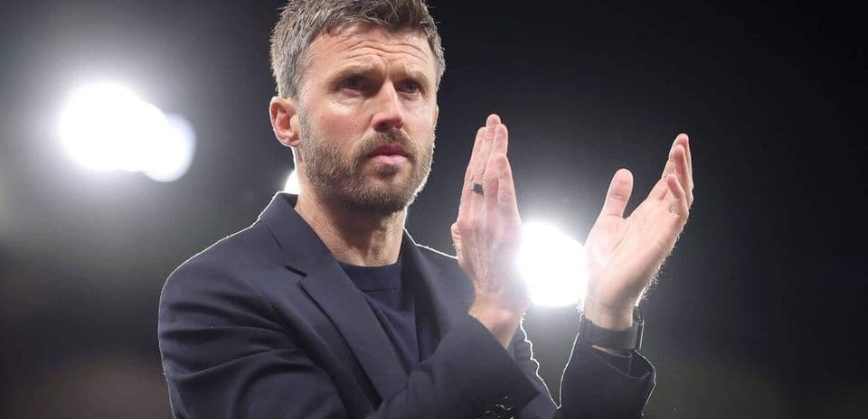 Coach applauding during a match at the stadium