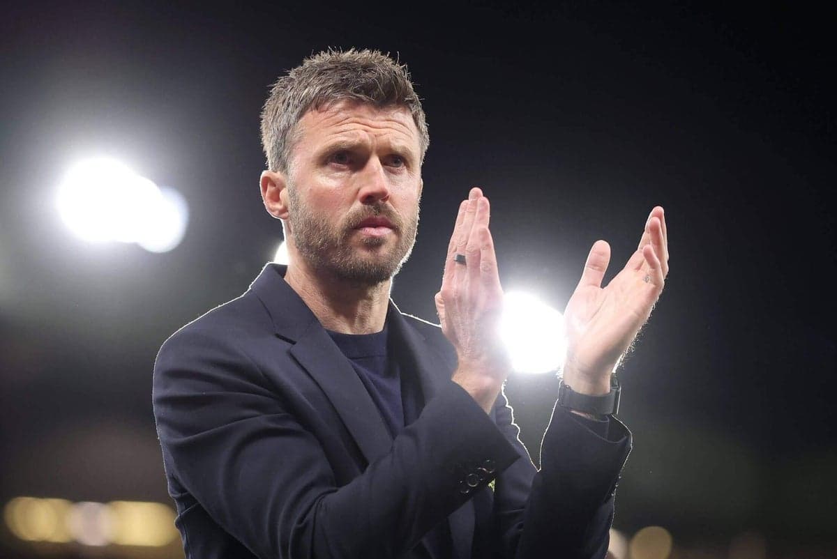 Coach applauding during a match at the stadium