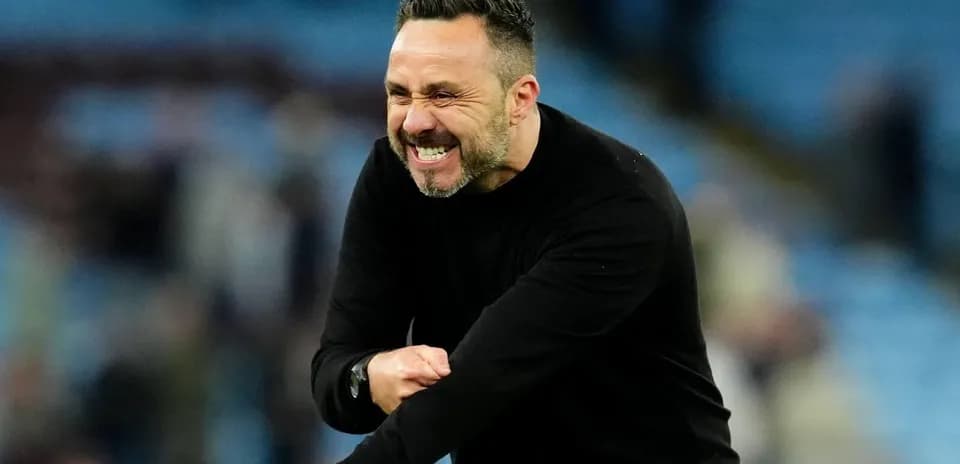 Coach celebrating during a match on the sideline