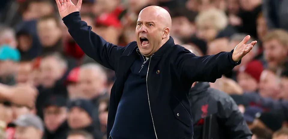 Coach gesturing passionately during a match