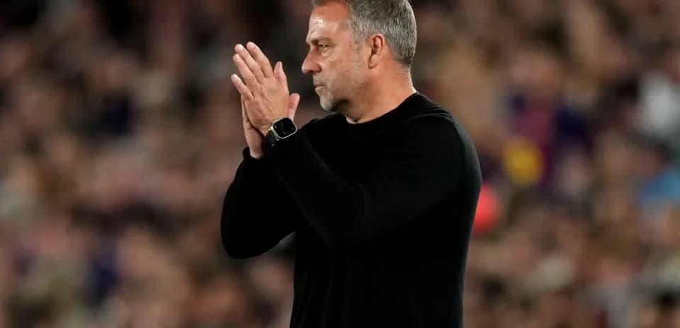 Coach applauding during a match on the sidelines