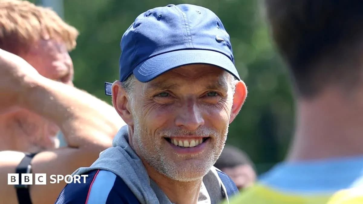 Coach smiling during training session with players