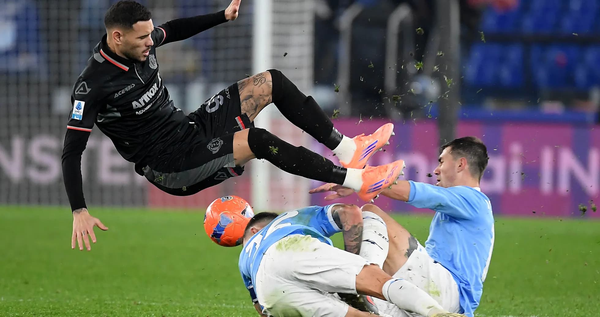 Cremonese player airborne during match against Lazio