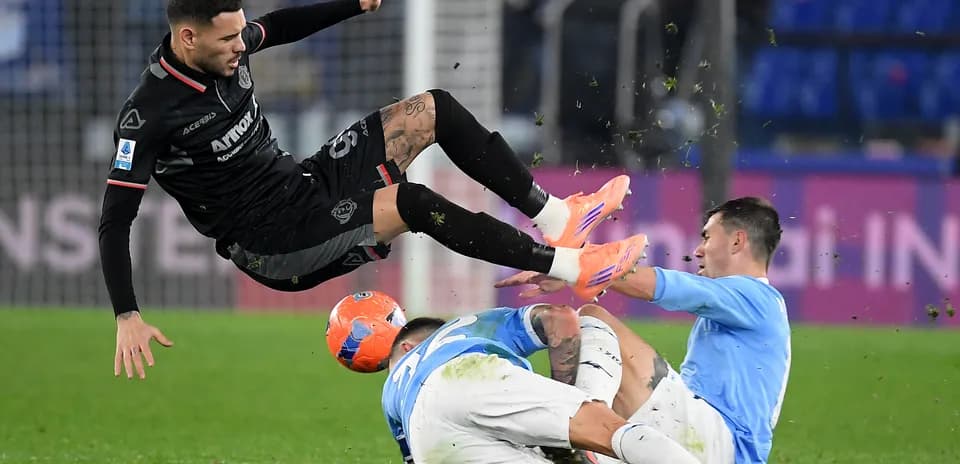 Cremonese player airborne during match against Lazio