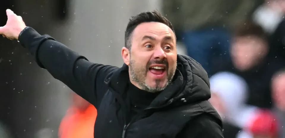 Coach gesturing during a football match