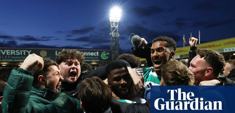 Fans celebrating passionately after a football match