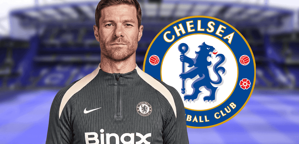 Coach in Chelsea training kit with club logo