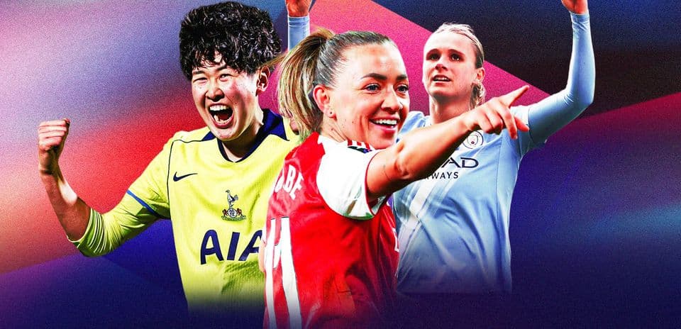 Three female football players celebrating with raised fists