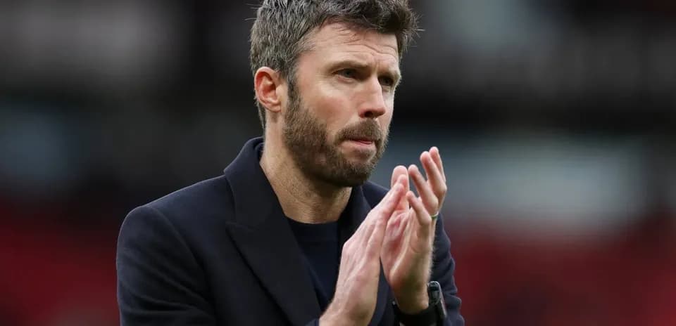 Coach applauding on the sidelines during match