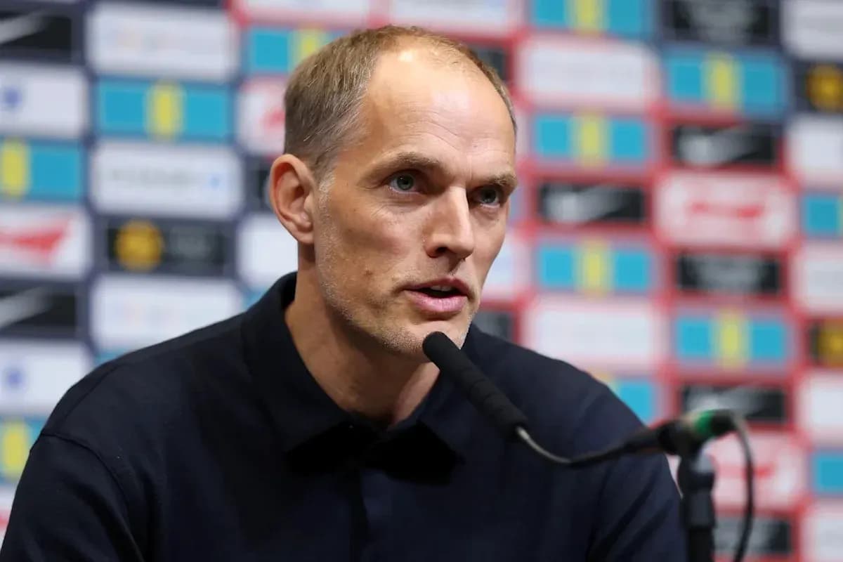 Coach speaking at press conference with microphone