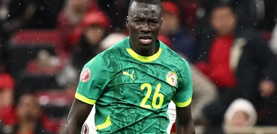 Player in green jersey during football match