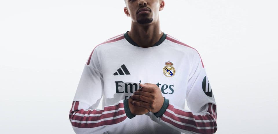 Player wearing Real Madrid jersey with hands clasped