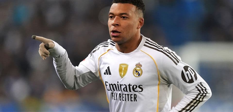 Player in Real Madrid jersey pointing during match