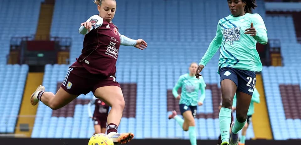 Player kicking ball during WSL match