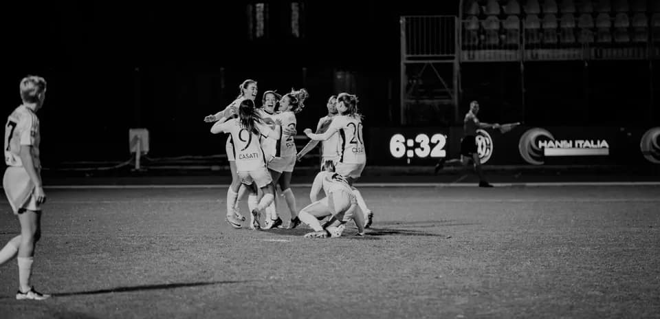 Celebration after a goal in women's football match