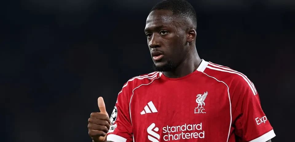 Player in Liverpool jersey giving thumbs up gesture