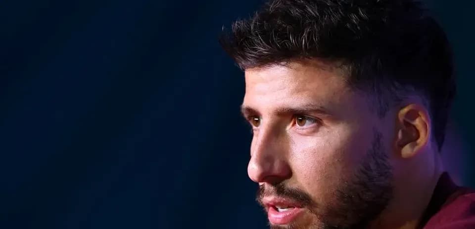Player speaking at press conference, close-up shot