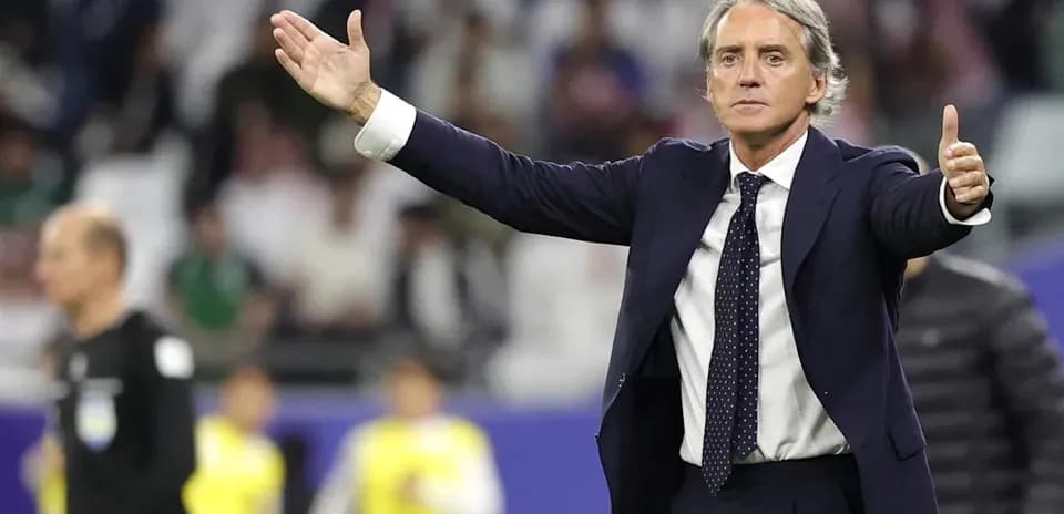 Coach gesturing during a football match on field