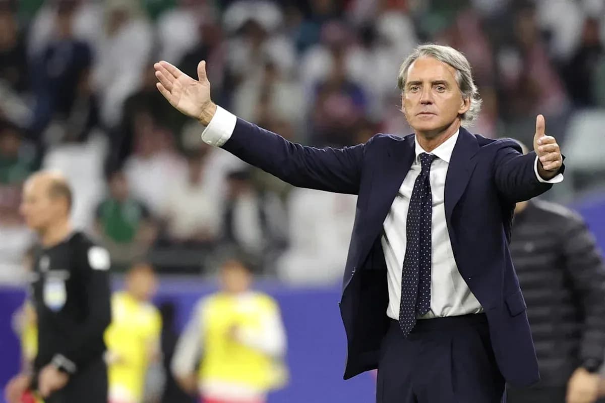 Coach gesturing during a football match on field