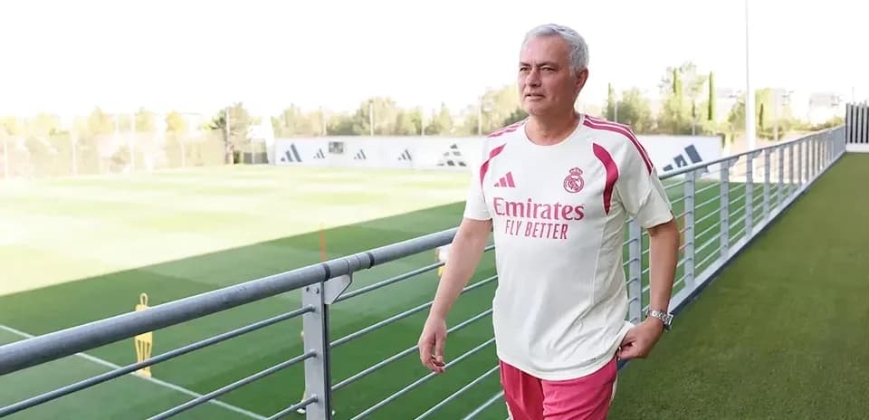 Coach walking on training pitch at Real Madrid