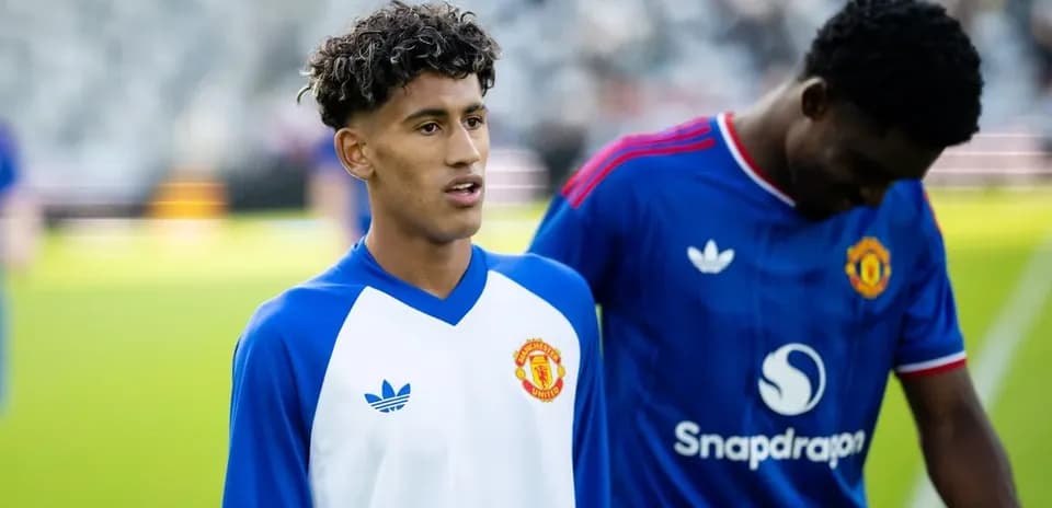 Two Manchester United players during warm-up on field