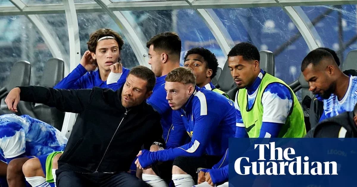 Coach instructing players on the bench during match