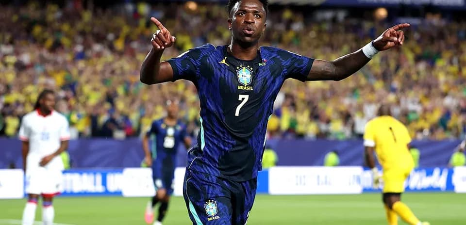 Player celebrating goal with fans in background