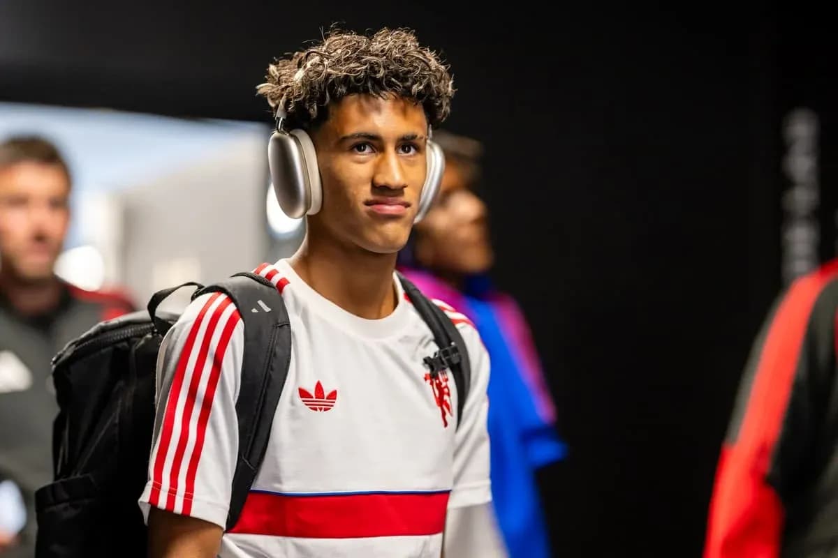 Player wearing headphones entering locker room