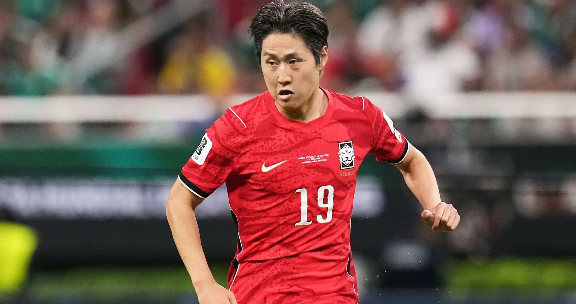 Player wearing red jersey running on the field