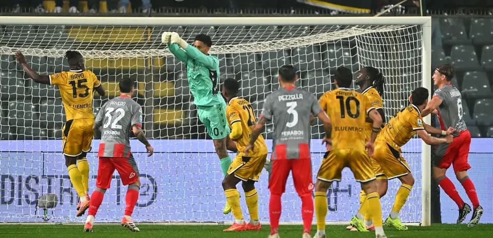 Goalkeeper saving a shot during Serie A match
