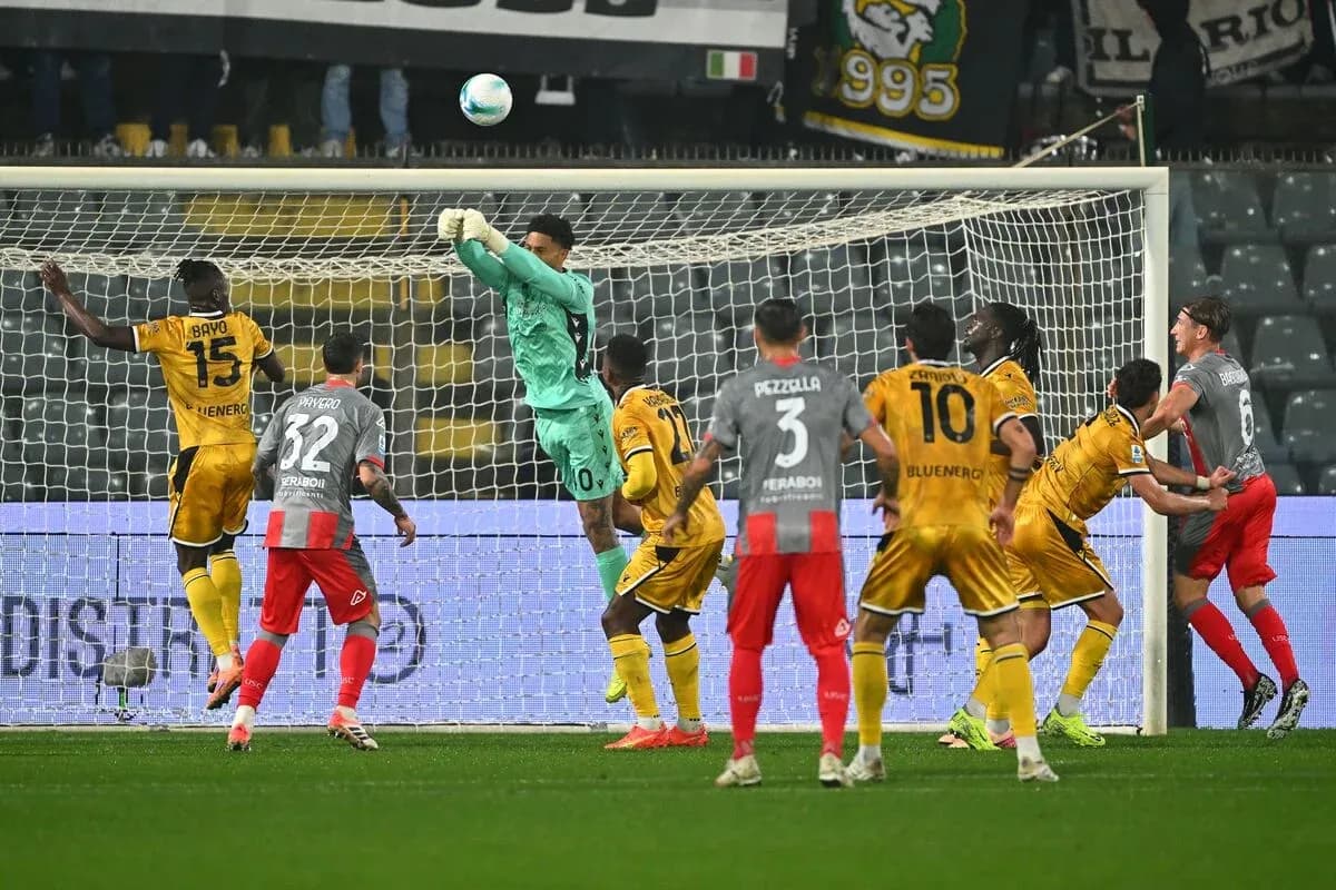 Goalkeeper saving a shot during Serie A match